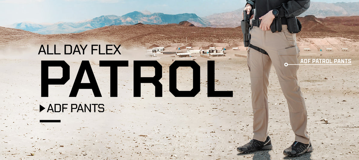 A person standing in a desert landscape wearing tan ADF Patrol pants, a black shirt, and black boots, with large text reading 'ALL DAY FLEX PATROL' and 'ADF PANTS' over the scene.